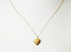 So cute and dainty !Tiny heart locket has a cute pink centerInside there is room for a small pictureChoose chain length at checkout Pink Heart Charm Necklace With Heart Pendant, Dainty Pendant Locket Necklace, Delicate Pink Heart Pendant Necklace, Pink Heart Pendant Dainty Jewelry, Pink Dainty Heart Pendant Charm Necklace, Dainty Pink Heart Pendant Charm Necklace, Dainty Pink Heart Charm Necklace, Personalized Pink Heart Charm Necklace, Dainty Pink Heart Pendant Jewelry