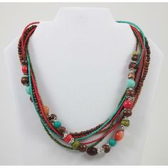 "This Boho style multi-strand beaded necklace is an 18\" long vibrant accessory, perfect for adding a pop of color to any outfit. Its bright, multi-colored beads are designed in a stylish, layered arrangement that's sure to turn heads. Beads are a mixture of glass, plastic, wood, stone, and seed beads. * Bright, multi-colored beads * Stylish multi-strand design * 18\" length * Perfect for adding a pop of color * Boho style Measurements: Length 18 in / 46 cm Extender Length 3 in / 8 cm Condition: Pre-Owned Good In wearable condition with lobster clasp. Please see photos.  We try to show all details and flaws accurately in the photos, but if you have additional questions, please let us know." Adjustable Multi-strand Necklace With Polished Beads, Adjustable Multi-strand Polished Beads Necklace, Multi-strand Wooden Beads For Jewelry Making, Wooden Multi-strand Beads For Jewelry Making, Multicolor Multi-strand Beaded Necklaces For Beach, Adjustable Double Strand Layered Necklace With Colorful Beads, Multicolor Multi-strand Beads For Beach, Multicolor Multi-strand Beach Beads, Adjustable Multi-strand Beaded Necklace