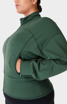 A wide, fitted hem creates a blouson effect in an ultrastretchy jacket cut in a cropped silhouette with cozy dropped shoulders and nifty zip pockets. Sweat-wicking fabric keeps you feeling dry and comfortable no matter what the day has in store for you. 22" length (size medium) Stand collar Dropped shoulders Moisture-wicking fabric engineered for dryness and comfort 70% nylon, 30% elastane Machine wash, dry flat Imported Sweaty Betty, Moisture Wicking Fabric, Drop Shoulder, Stand Collar, Zip Pockets, Nordstrom