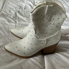 Brand New. Pointed Toe. White. Padded Soles. Heeled. Booties. Size 8. (I Am Usually A Size 8.5/9- These Run Small) *Pet Friendly Home *Smoke Free Home Summer Boots With Rhinestones And Round Toe, White Rhinestone Boots For Fall, White Rhinestone Boots With Round Toe, White Rhinestone Boots For Spring, Spring Ankle-high Boots With Rhinestones, Ankle-high Boots With Rhinestones For Spring, Ankle-high Spring Boots With Rhinestones, Spring Ankle-high Rhinestone Boots, Ankle-high Rhinestone Boots For Spring