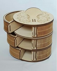 an intricately designed wooden box is stacked on top of each other with the lid open