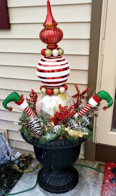 a potted plant with christmas decorations on it