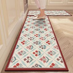 a woman is standing on the kitchen floor with her feet in the doormats