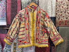 Handmade Item  Indian Women's Phulkari Embroidered Stylish Designer Jacket, Indian Handmade Embroidery Jacket, Traditional Festival Kutch Banjara Jacket Woman's jacket cotton Designer embroidery. This jacket was hand-made with vintage style phulkari embroidery by artisans from the nomadic desert tribe known as "Banjara ", in the Northern India. The Jacket is no closure pattern with Long Sleeves and Vibrant Color Item Detail - Material :- Cotton With Thread Work And Sequence. Length :- 24" Inches Spring Traditional Long Sleeve Wear With Dori Work, Nehru Jacket With Floral Embroidery For Navratri, Floral Embroidered Nehru Jacket For Navratri, Spring Traditional Wear With Dori Work, Bohemian Embroidered Nehru Jacket For Winter, Festive Embroidered Nehru Jacket For Spring, Folk Outerwear With Intricate Embroidery For Festive Occasions, Bohemian Choli With Floral Embroidery For Spring, Festive Folk Embroidered Outerwear