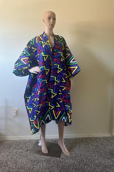 Discover bold styles with our ready-to-wear one-size-fits-all Quality African Print Kimonos, Handmade from premium cotton and perfect for all events. Oversized Multicolor Robe With Kimono Sleeves, Multicolor Printed Outerwear With Kimono Sleeves, One Size Patterned Kimono, Multicolor Print Kimono With Vibrant Print And Kimono Sleeves, Multicolor Cotton Outerwear With Kimono Sleeves, Multicolor Printed Long Sleeve Robe, Multicolor Long Sleeve Printed Robe, Multicolor Kimono With Kimono Sleeves, Oversized Multicolor Kaftan With Kimono Sleeves