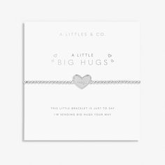 Celebrate all of life's treasured moments with those that mean the most with our ever-growing collection of A Littles. Featuring our signature beaded design that ensures a comfortable fit on any wrist, and crowned with a special silver-plated engraved heart charm to share a little love when the going gets tough, the A Little 'Big Hugs' Bracelet In Silver Plating comes carefully wrapped around a sentiment-stamped presentation card, ready to spread joy and make the sweetest addition to your loved one's stack. Silver-Plated One Size Fits All Nickle Free Silver Jubilee Stretch Bracelet As Gift, Hypoallergenic Silver Friendship Bracelets For Mother's Day, Adjustable Sterling Silver Stretch Bracelet Gift, Silver Stretch Bracelet Gift For Mother's Day, Inspirational Sterling Silver Friendship Bracelets, Adjustable Heart Bracelet With Silver Beads For Gift, Inspirational Silver Beaded Friendship Bracelets, Inspirational Silver Beaded Bracelets As Gift, Silver Stretch Bracelet For Mother's Day