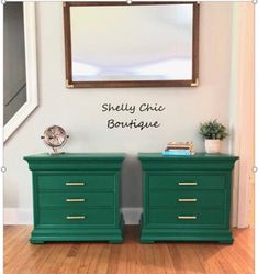 two green dressers sitting next to each other on top of a hard wood floor