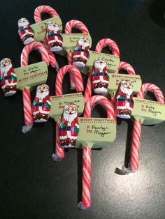 several candy canes with santa clause on them