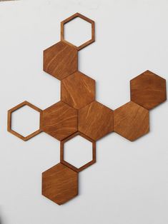 some wooden hexagonals on a white surface