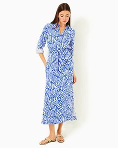 Easy fit, ankle-length, maxi shirtdress with a collar and half placket. Style also features long sleeves, tall side slits, and a separate self sash. 54 1/2" from top of shoulder to hem (based on a size small/4). Enjoy extra hem flexibility with this style. Wear as-is or let it out for some extra length.  Lagoon Linen™ (100% Linen). Machine wash cold, delicate cycle, separately. Imported. Elevate your everyday style with our breezy Millicent Linen Maxi Shirtdress. Chic Collared Maxi Dress For The Beach, 3/4 Sleeve Shirt Dress For The Beach, Elegant Collared Maxi Dress For Beach, Collared Blue Maxi Dress For Spring, Elegant Maxi Shirt Dress For Vacation, Blue Chic Relaxed Fit Maxi Dress, Elegant Blue Maxi Length Shirt Dress, Elegant Blue Maxi Shirt Dress, Elegant Maxi Dress With 3/4 Sleeves For Beach