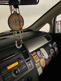 the interior of a car with stickers on the dash board and steering wheel controls