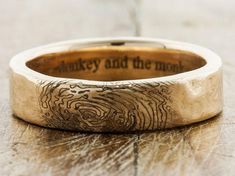 a wedding band that has been engraved with the words monkey and the moon