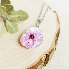 This real cherry blossom necklace, a real flower necklace, is part of my Spring jewelry. A delicate flower necklace as a superb girlfriend gift idea. Botanical flower in your way of dressing to acquire that special and different touch. Wearing this real cherry blossom necklace you will never go unnoticed! The hypoallergenic stainless steel chain and the high-gloss crystalline resin give this real flower necklace a precious and enameled look. My real real cherry blossom necklace is perfect for in Delicate Blossom Color Necklaces, Blossom Petal Shaped Jewelry For Gifts, Delicate Blossom-colored Jewelry For Gifts, Delicate Blossom Colored Jewelry As Gift, Delicate Blossom Jewelry Gift, Delicate Blossom Flower Pendant Necklace, Delicate Blossom Color Flower Pendant Necklace, Delicate Pink Flower Pendant Necklace, Delicate Pink Pendant Flower Necklace