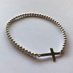 Silver Cross Bracelet - Sterling Silver Bracelet with Cross - Christening Gift Ideas - Cross Jewelry - Christian Jewelry - Meaningful Gift Sterling Silver 925 Weight: 3,2 g Length: 17 cm (6.69 inches), made on a strong rubber thread, so it can be slightly extended Dimensions of the cross: 2 cm x 1 cm (0.78 x 0.39 inches) Art.: M-49032B Made in Spain For more MOSA designs, please, visit my online store at www.BestSpanishShop.com Adjustable Silver Cross Beaded Bracelets, Adjustable Silver Beaded Bracelets With Cross Shape, Adjustable Silver Beaded Cross Bracelets, Adjustable Cross Stretch Bracelet As Gift, Bracelet With Cross, Silver Cross Bracelet, Pomegranate Necklace, Pomegranate Jewelry, Jewelry Techniques