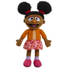 the muppet doll is wearing an orange shirt and pink skirt