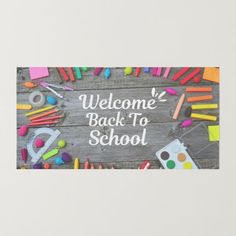 the welcome back to school sign is surrounded by colorful crayons and pencils