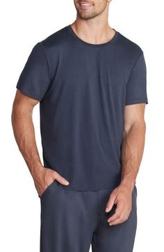 Lightweight and exceptionally soft, this stretchy T-shirt makes a great choice for the gym, a relaxing afternoon or a night of sweet, sweet slumber. Crewneck Short sleeves 91% polyester, 9% spandex Machine wash, tumble dry Imported Moisture-wicking Stretch T-shirt For Loungewear, Soft Relaxed Fit Tops For Loungewear, Comfy Relaxed Fit Tops For Sports, Relaxed Fit Soft Cotton Tops, Cotton Crew Neck T-shirt For Lounging, Relaxed Fit Soft Top For Relaxation, Fitted Black Top For Lounging, Black Fitted Top For Lounging, Relaxed Fit Short Sleeve Activewear