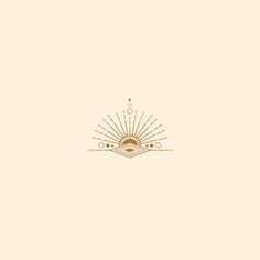 a gold and white logo with the sun in the middle, on top of a beige background