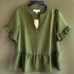 Brand New Smoky Olive Green Michael Kors Lightweight Textured Short Sleeve V-Neck Top. Relaxed, Cute Look! Women’s Size Medium. Retail Is $98. Elevate Your Everyday Look With This Gorgeous Michael Kors Blouse. The Smoky Olive Green Color And Flutter Sleeves Add A Touch Of Femininity, While The Relaxed Fit And Lightweight Material Make It Perfect For Casual Wear. The V-Neckline And Ruffled Accents Give It A Stylish Edge, And The Textured Polyester Material Adds Depth To The Design. This Blouse Is Casual Workwear Blouse With Ruffle Hem, Casual Blouse With Ruffle Hem For Workwear, Short Sleeve Workwear Blouse With Ruffle Hem, Short Sleeve Ruffle Hem Blouse For Work, Summer Peplum Top With Ruffles For Work, Short Sleeve Blouse With Ruffle Hem For Work, Summer Ruffled Peplum Top For Workwear, Summer Ruffle Peplum Top For Work, Summer Workwear Tops With Ruffle Hem