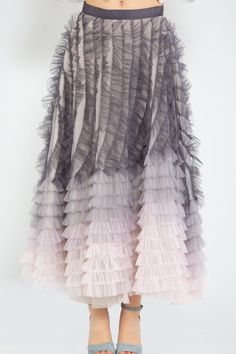 An elegant choice for a formal dinner or a wedding but can be worn many times after, too. It's made from layers of feathered-embroidered tulle that'll swish so prettily on the dance floor. Complement the skirt with a stunning cropped top. -- Product Details 100% Polyester Fully Lined Midi Length Feathered Detail Gray/Pink Ombre Design Concealed Zip Closure Regular Fit Elegant Tulle Skirt With Ruffles, Elegant Tulle Skirt With Attached Cancan, Evening Tulle Flowy Skirt, Elegant Tulle Dress With Feathers, Formal Tulle Dress With Feather Trim, Formal Tulle Dress With Flowy Skirt, Formal Tulle Dress With Tiered Skirt, Elegant Tulle Skirt For Formal Occasions, Elegant Tiered Skirt For Prom