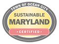 the town of ocean city seal is shown in yellow and pink, with words that read,