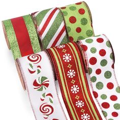 christmas ribbon assortment with red, green and white designs on it's edges are lined up against each other