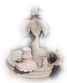 a small fountain with two statues in it