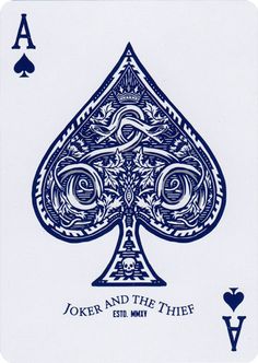 a blue and white playing card with the words joker and the thief written on it