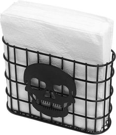 a black basket with tissue and a skull on it