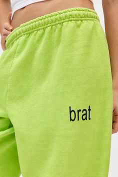 So brat in these sweatpants style topped with a Charlie XCX Brat graphic at the front. Designed in a soft, brushed knit featuring a mid-rise elasticated waistband, relaxed tapered leg and cinched hems. Only at Urban Outfitters. Features Charli XCX Brat graphic jogger sweatpant Graphic lounge pant Soft brushed knit Mid-rise elasticated waistline Brat graphic at the front Relaxed, tapered fit Ankle length Easy pull-on style UO exclusive Content + Care 50% Cotton, 50% polyester Machine wash Imported Size + Fit Model in Green is 5’9" and wearing size Small Measurements taken from size Medium Waist: 28" Inseam: 29" Length: 44" | Charli XCX UO Exclusive Brat Graphic Jogger Sweatpant in Green, Women's at Urban Outfitters Elastic Waistband Sweats For Spring Streetwear, Spring Streetwear Sweats With Elastic Waistband, Casual Green Sweatpants With Comfort Waistband, Green Stretch Sweatpants For Leisure, Green Sweats For Spring Streetwear, Green Bottoms With Letter Print For Spring, Green Letter Print Bottoms For Spring, Trendy Cotton Sweatpants With Comfort Waistband, Green Sweats With Elastic Waistband For Loungewear