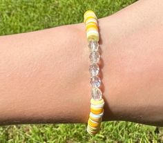 Cute yellow and white beaded bracelet. These are high quality handmade bracelets. They are made with an elastic string so will fit lots of sizes. They are around 6.75 inches. Please note that each braclet will have a very similar beading pattern but not exactly identical. White Friendship Bracelets With Faceted Round Beads, Casual White Beaded Bracelets With Faceted Beads, Adjustable Yellow Beaded Bracelets With Faceted Beads, Adjustable Yellow Faceted Beads Stretch Bracelet, Casual Yellow Beaded Bracelets With 8mm Beads, Casual Yellow Beaded Bracelet With 8mm Beads, Adjustable White Stretch Bracelet With Faceted Beads, White Stretch Bracelet With Faceted Beads, Adjustable Hypoallergenic Yellow Beaded Bracelet