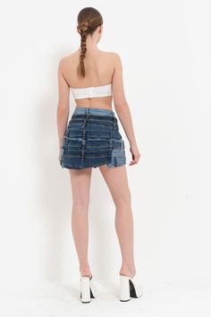 In stock and ready to ship in 1-2 business days. Made in Europe and available for a limited time only! This edgy, unique button up mini skirt features multiple layers of high quality denim, functional buttons and frayed details. Color may vary due to lighting Material: cotton Care: machine wash cold Model is 5' 6" and wearing a size S Edgy Cotton Denim Skirt For Summer, Edgy Dark Wash Denim Skirt For Summer, Edgy Denim Mini Skirt For Summer, Fitted Cotton Cutoff Mini Skirt, Fitted Cotton Cutoff Skirt, Dark Wash Cotton Mini Skort, Edgy Fitted Cutoff Mini Skirt, Edgy Fitted Dark Wash Mini Skirt, Edgy Denim Skirt For Summer