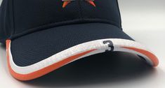 "Update your Houston Astros game with our Exclusive BRIMMTRIMM Hat Accessory! The BRIMMTRIMM is fully customizable! Base color for this Astros BrimmTrimm comes in White. The Piping can be either Orange (as pictured) or Navy Blue. The Text/Number Color also comes in Orange or Navy (as pictured). Use the Variations dropdowns to choose your piping/text combo. This BrimmTrimm is also available with NO PIPING. The BRIMMTRIMM can be customized with any former or current Astros players number, Name or Phrase.  BRIMMTRIMM will fit on most baseball/trucker style hats and can be taken on and off in a mere 15 seconds. See the personalisation section to order your number or text. If you would like the player number in the picture gallery please enter that number.  The personalisation section MUST BE F Yellow Astros Fitted Hat, Sports Stocking Stuffers, Astros Game, Sports Team Apparel, Houston Astros, Personalized Christmas Gifts, Custom Hats, Trucker Cap, Hat Fashion