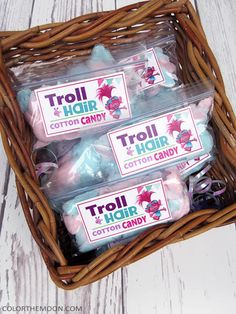 three bags of troll candy in a basket