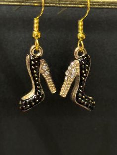 made by me! Novelty gilded gold tone and BLACK enamel and diamanté antique Vintage stiletto high heel shoe drop earrings for pierced ears! Other designs availiable See last 2 pics   ... beautiful quality charms :-)   Happy to convert to clip on ... just ask ;-)  Please take a look at my other handmade novelty earrings and antique and vintage collections in my Etsy shop. Black Enamel Drop Earrings For Party, Gold Jewelry With Black Enamel For Party, Vintage Collections, Novelty Earrings, Gold Gilding, High Heels Stilettos, Pierced Ears, Black Enamel, Antique Vintage