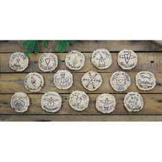 twelve decorated cookies with writing on them