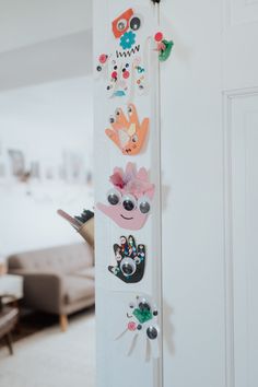 the door handle is decorated with stickers and magnets