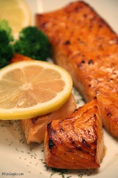 salmon, broccoli and lemon on a plate