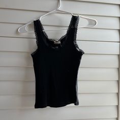 Brandy Melville John Galt Black Ronnie Lace Rib Tank Top Condition: Brand New, Never Worn, Tags Removed - As Shown In Image - All Prices Are Firm All Questions And Concerns Are Welcome! **All Items Final Sale** Tops Brandy Melville, Brandy Melville Tank Top, Rib Tank Top, Brandy Melville Tank, John Galt, Brandy Melville Tops, Ribbed Tank Tops, Feminine Look, Black Tank Tops