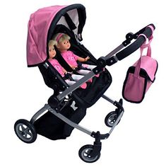 two dolls are sitting in a stroller