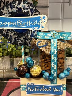 a birthday cake with chocolates and candies in it on top of a table