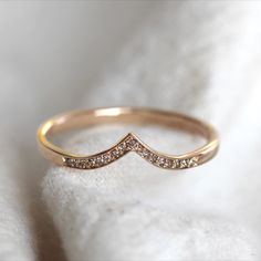 Beautiful and delicate wedding ring. This dainty diamond set band gently forming into a wishbone shape to fit against a variety of designs. Thread and grain set cinnamon diamonds add some sparkle to the piece. Delicate Wedding Ring, Dainty Wedding Ring, Engagement Rings Couple, Delicate Wedding, Black Beaded Jewelry, Basic Jewelry, Gold Ring Designs, Simple Engagement Rings