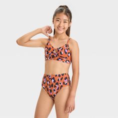 Get them dressed in roaring style by wearing the Hand-Drawn Cheetah Printed Bikini Set from art class™. This two-piece bikini set includes an orange bikini top and bottom, both with hand-draw-style cheetah print in purple and black for colorful appeal. The top is embellished with a front O-ring and decorative tie at the front, while the removable cups help provide customizable coverage. Made from recycled polyester material with stretchy spandex and full lining, this swimwear set offers comfort Teen Summer, Hand Draw, Swimwear Sets, Kids Outfits Girls, Swimwear Fashion, Art Class, Cheetah Print, O Ring, Girls Shopping