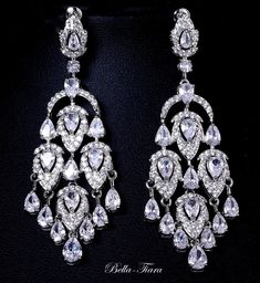 New Part of our Royal CollectionLets welcome to Bella-Tiara's royal collection the stunning Claudia chandelier earrings. elegance and glamour at its finest. Statement Swarovski drop with bold royal inspired look, exclusively at Bella-Tiara.Be Bella Approx 2 1/2" long pierce drop earrings -------------------------------------- *Note processing time is not shipping time, our regular Free shipping takes approx. 5-6 days to receive after shipped. With rush processing your order is expedited and you Formal Chandelier Earrings With Rhinestones, Formal Chandelier Earrings With Rhinestones And Cubic Zirconia, Glamorous Crystal Chandelier Earrings With Elegant Design, Luxury Crystal Chandelier Earrings For Formal Occasions, Elegant Crystal Chandelier Earrings For Evening, Elegant Dangle Chandelier Earrings For Glamorous Events, Glamorous Chandelier Earrings With Elegant Design, Formal Crystal Dangle Chandelier Earrings, Swarovski Crystal Chandelier