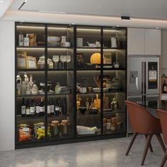 an open kitchen with lots of bottles on the shelves and chairs in front of it