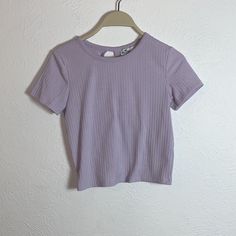 Super Cute Nwot Hollister Lavender Tie-Back Shirt Size Xs. In Excellent Condition, Never Worn Before. Open To Reasonable Offers And Questions! Fitted Lavender Short Sleeve Top, Fitted Basic Purple Top, Stretch Purple T-shirt For Spring, Lavender Trendy T-shirt For Summer, Trendy Lavender T-shirt For Summer, Lavender Crew Neck Basic Top, Basic Lavender Crew Neck Top, Trendy Lavender Summer T-shirt, Casual Lavender Summer Shirt