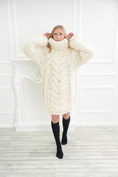 Perfect for home or evening events, this super giant chunky turtleneck wool sweater is a classic piece to go with anything in your closet. The chunky knit and slightly oversize loose fit has 5 layers of high quality wool thats made for comfort and good visual look. Chunky knit sweater Cozy White Sweater Dress For Fall, Winter White Sweater Dress For Winter, Cozy White Sweater Dress For Winter, Cream Chunky Knit Turtleneck Sweater, White Cable Knit Sweater Dress For Fall, Cozy Winter White Turtleneck Sweater, Cream Chunky Knit Sweater For Winter, Cozy Hand Knitted Winter White Sweater, Cozy Hand-knitted Winter White Sweater