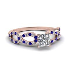 a rose gold engagement ring with blue sapphire stones