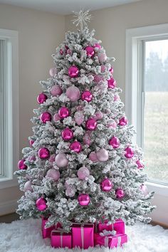 a christmas tree with pink and silver ornaments