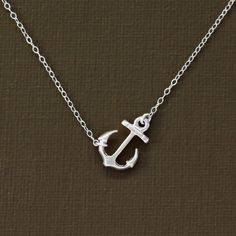 "The perfect anchor necklace for every day. A cute little anchor is strung on a quallity sterling silver chain. Perfect for layering! Necklace measures 16\" or 18\" from clasp to clasp. Shown on me in 16\". Anchor measures approx .75 inch long. Also available in gold. Simply select from drop down menu. ► All NINA KUNA jewels come in a complimentary jewelry bag. ► We love to layer our necklaces! Add a removable extender to get the perfect fit for your new or existing necklace: https://www.etsy.co Everyday Nautical Anchor Jewelry, Everyday Silver Jewelry With Anchor Shape, Everyday Silver Anchor Jewelry, Nickel-free Sterling Silver Anchor Jewelry, Nickel-free Anchor Shaped Sterling Silver Jewelry, Silver Anchor Necklace In Sterling Silver, Silver Anchor Necklace Nautical Style, Silver Anchor Jewelry With Lobster Clasp, Nautical Sterling Silver Anchor Necklace